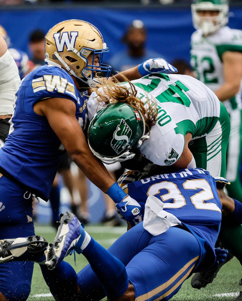 John Woods / THE CANADIAN PRESS FILES
Winnipeg Blue Bombers linebackers Kyrie Wilson (left) and Michael Griffin stop Saskatchewan Roughriders running back A.J. Ouellette (45) during last season’s Banjo Bowl.