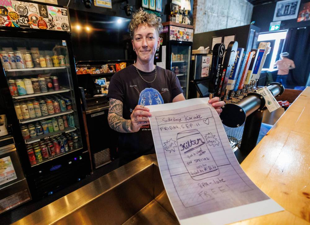 MIKE DEAL / FREE PRESS
Jenna Priestner, co-owner of Sidestage at 700 Osborne St., and a musician in Mobina Galore. Sidestage doesn’t use AI, and a recent hand-drawn poster Priestner made for a karaoke event got a lot of buzz for its anti-AI caption on social media.