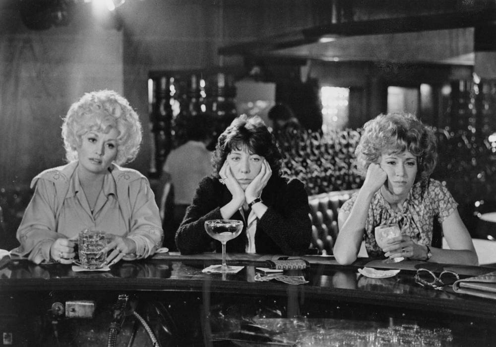 TWENTIETH CENTURY-FOX
Fed up with their lowly professional status, office workers Dolly Parton (from left), Lily Tomlin and Jane Fonda commiserate over drinks in the 1980 hit comedy 9 to 5.