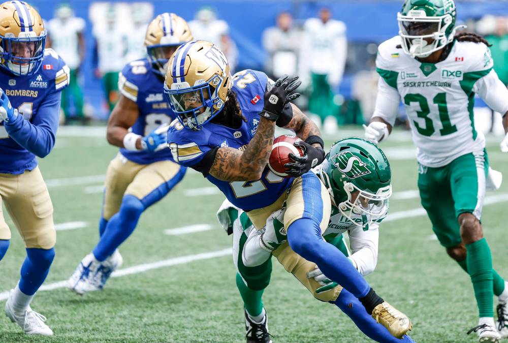 JOHN WOODS / THE CANADIAN PRESS
Winnipeg Blue Bombers’ Trey Vaval (23) returns the punt against the Saskatchewan Roughriders during first half CFL football action in Winnipeg on Saturday.