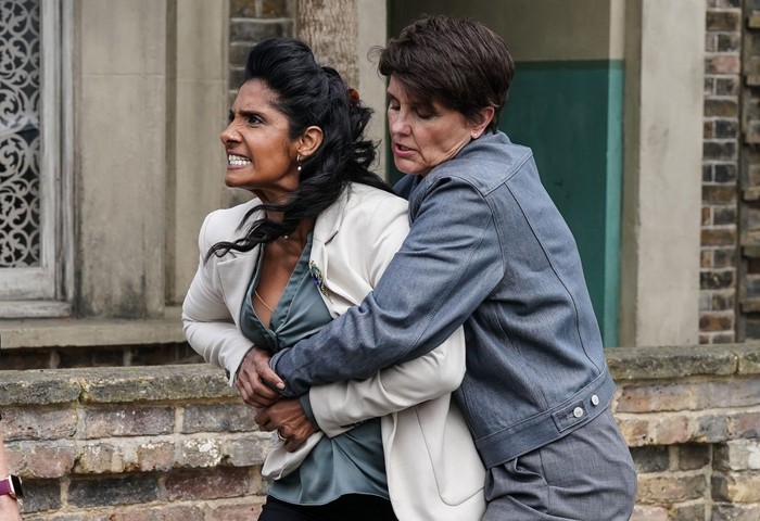 564833,TITLE:Eastenders Heather Peace as Eve Panesar-Unwin holds back Balvinder Sopal as an angry Suki Panesar-Unwin in EastEnders.