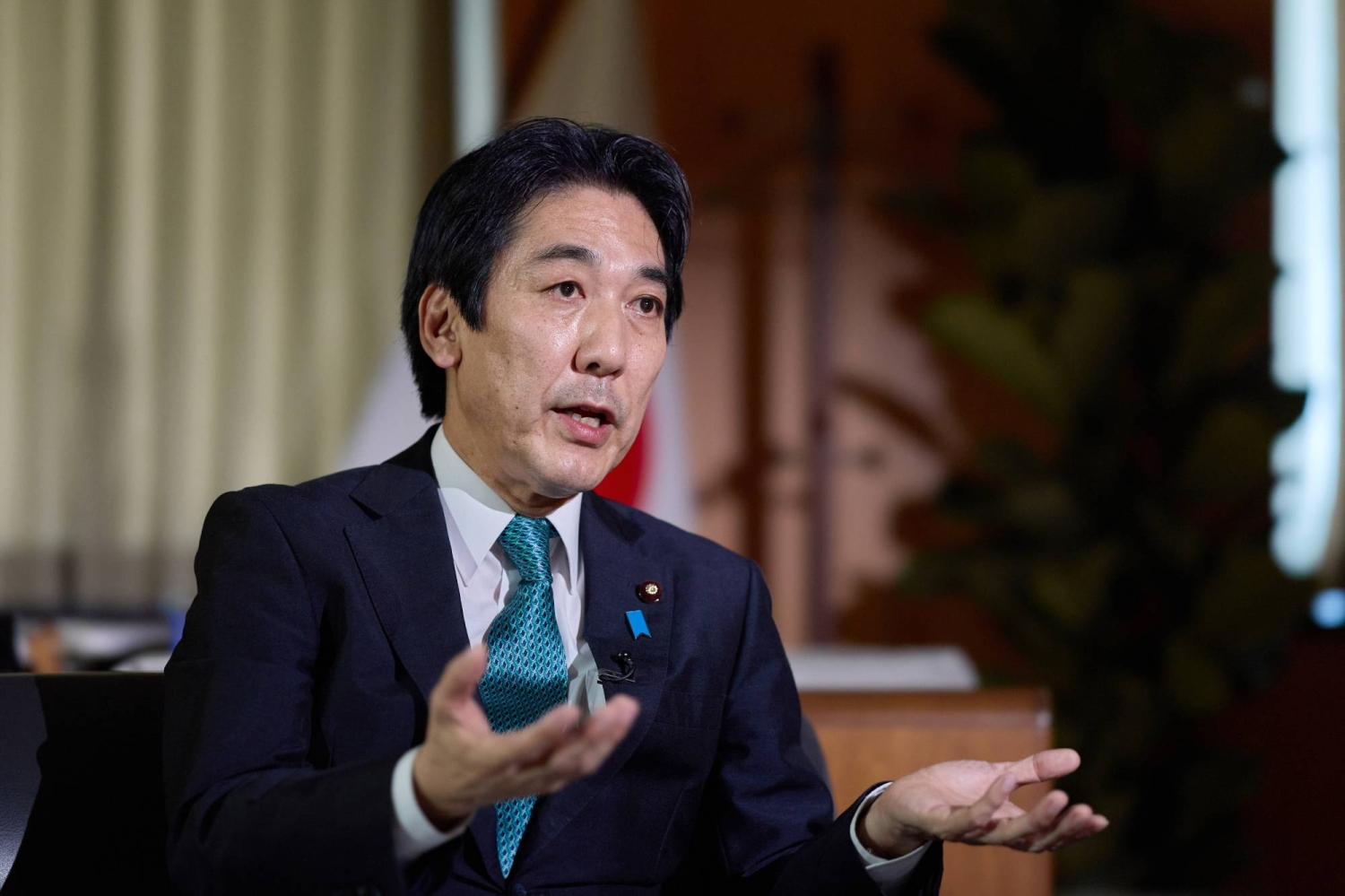 Japan growth minister says economy has exited reflationary phase