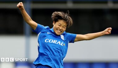 Birmingham City's Suzu Amano raises her arms in celebration after scoring a late equaliser against Crystal Palace