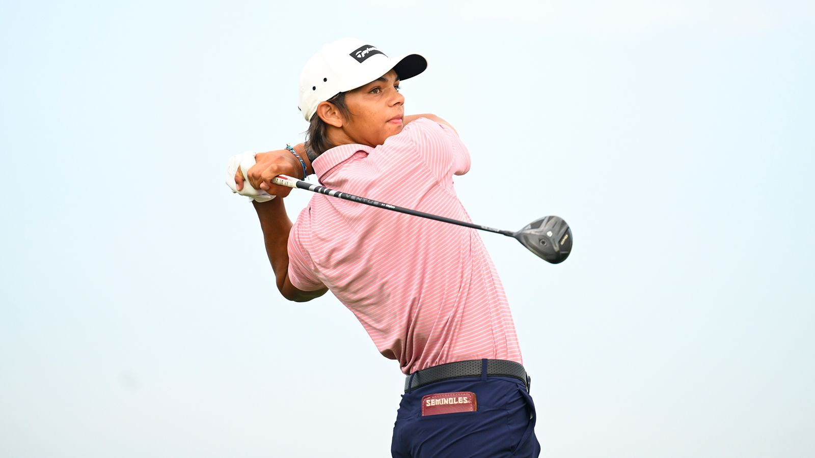 Charlie Woods hits a fairway wood off the tee