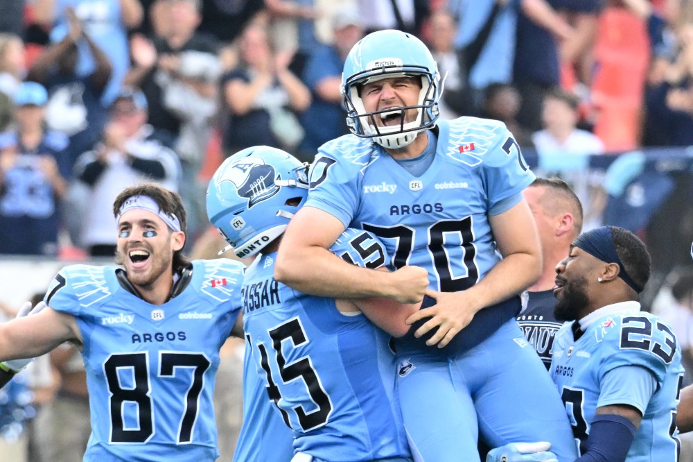 Toronto Argonauts kicker Lirim Hajrullahu (70) is hoisted by teammates after kicking the game-winning field goal against the Edmonton Elks during second half CFL football action in Toronto Saturday, Sept. 13, 2025. THE CANADIAN PRESS/Jon Blacker