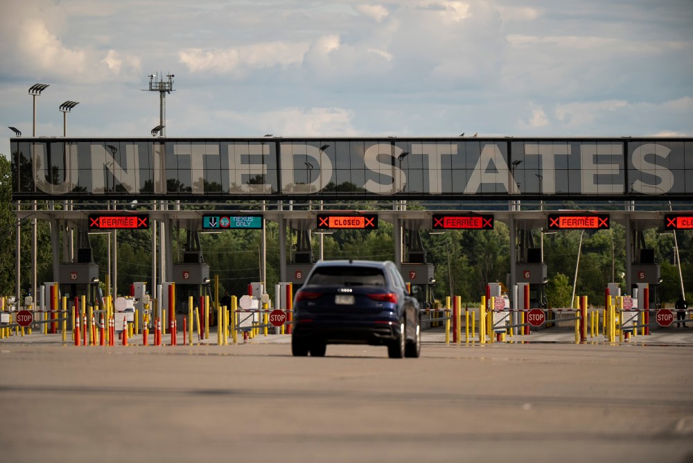 Vehicles approach the United States border as seen at Saint Bernard de Lacolle, Que., on Monday, July 21, 2025. THE CANADIAN PRESS/Christopher Katsarov