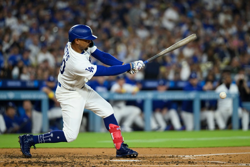 Los Angeles Dodgers' Mookie Betts hits for an RBI groundout during the third inning of a baseball game against the Washington Nationals in Los Angeles, Sunday, Sept. 6, 2026. (AP Photo/Kyusung Gong)