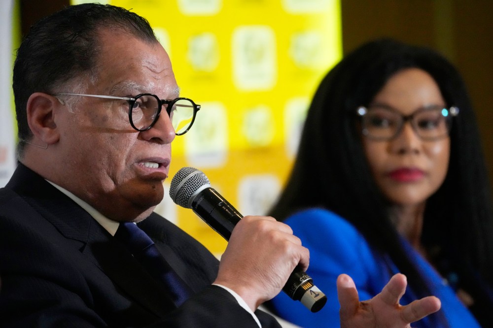 FILE - Danny Jordaan, South African soccer association president, left, speaks during a joint media briefing in Johannesburg, South Africa, on July 5, 2023. (AP Photo/Themba Hadebe, File)