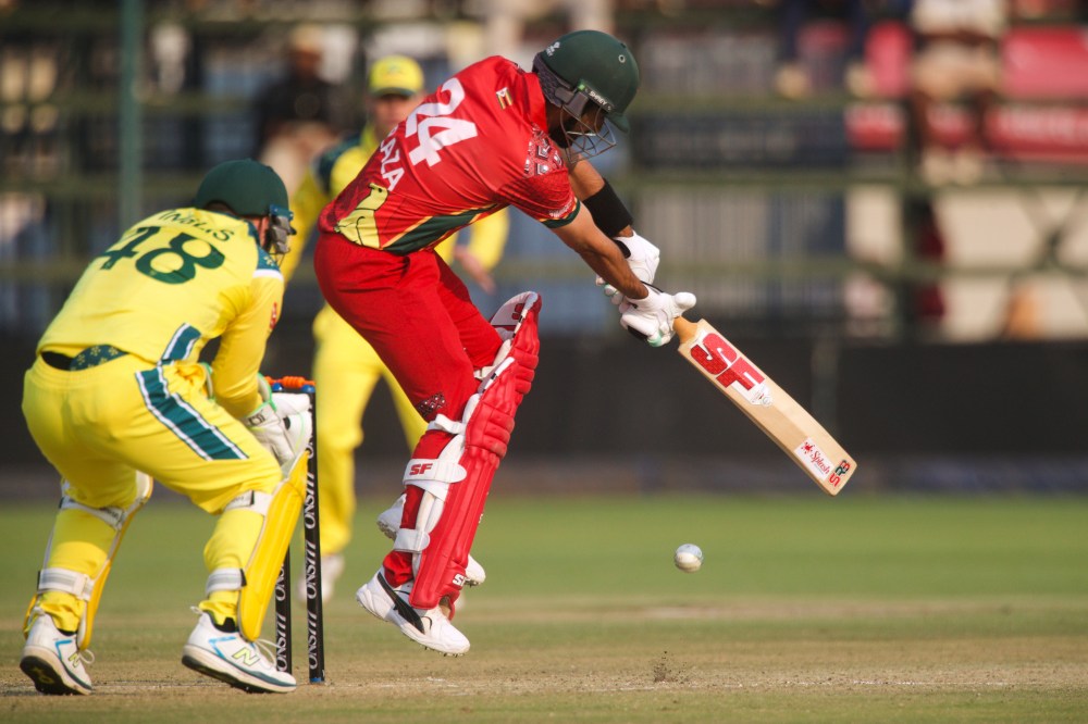 Zimbabwe's captain Sikandar Butt, right, plays a shot as Australia's wicketkeeper Josh Inglis watches on during a second one day international cricket match between Zimbabwe and Australia in Harare, Zimbabwe, Friday, Sept.18, 2026. (AP Photo/Wonder Mashura)