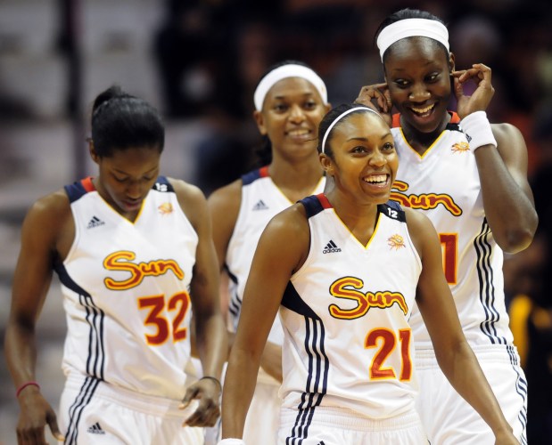 From left, former UConn players Asjha Jones, Kalana Greene, Renee Montgomery and Tina Charles take the court together for the Connecticut Sun in 2011.