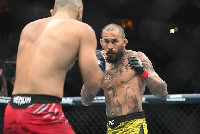 Oct 18, 2025; Vancouver, BC, CANADA; Marlon Vera (red gloves) fights Aiemann Zahabi (blue gloves) during UFC Fight Night at Rogers Arena. Mandatory Credit: Simon Fearn-Imagn Images