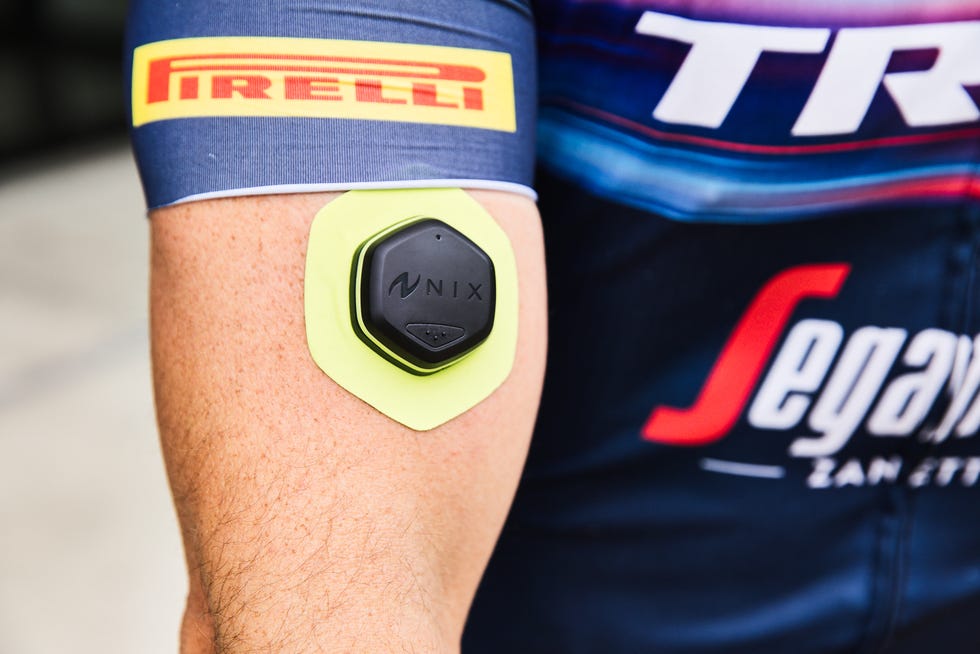 Nix wearable hydration sensor attached to an athlete's arm during a sporting event.