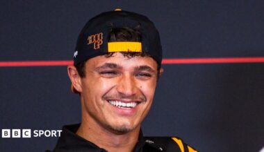 Lando Norris smiling during a Formula 1 news conference