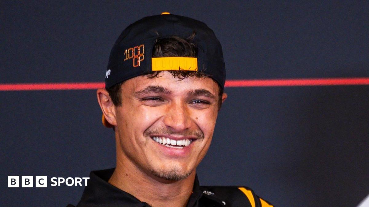 Lando Norris smiling during a Formula 1 news conference