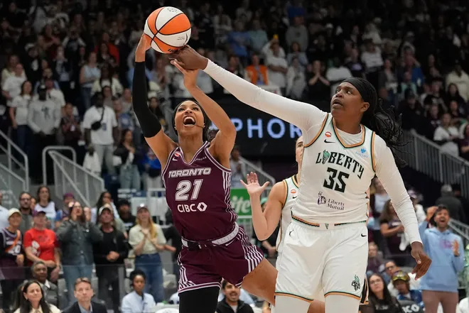 Sept. 20, 2026; Toronto, Ontario, Canada; New York Liberty center Jonquel Jones (35) and Toronto Tempo forward Isabelle Harrison (21) during the first half at Coca-Cola Coliseum.