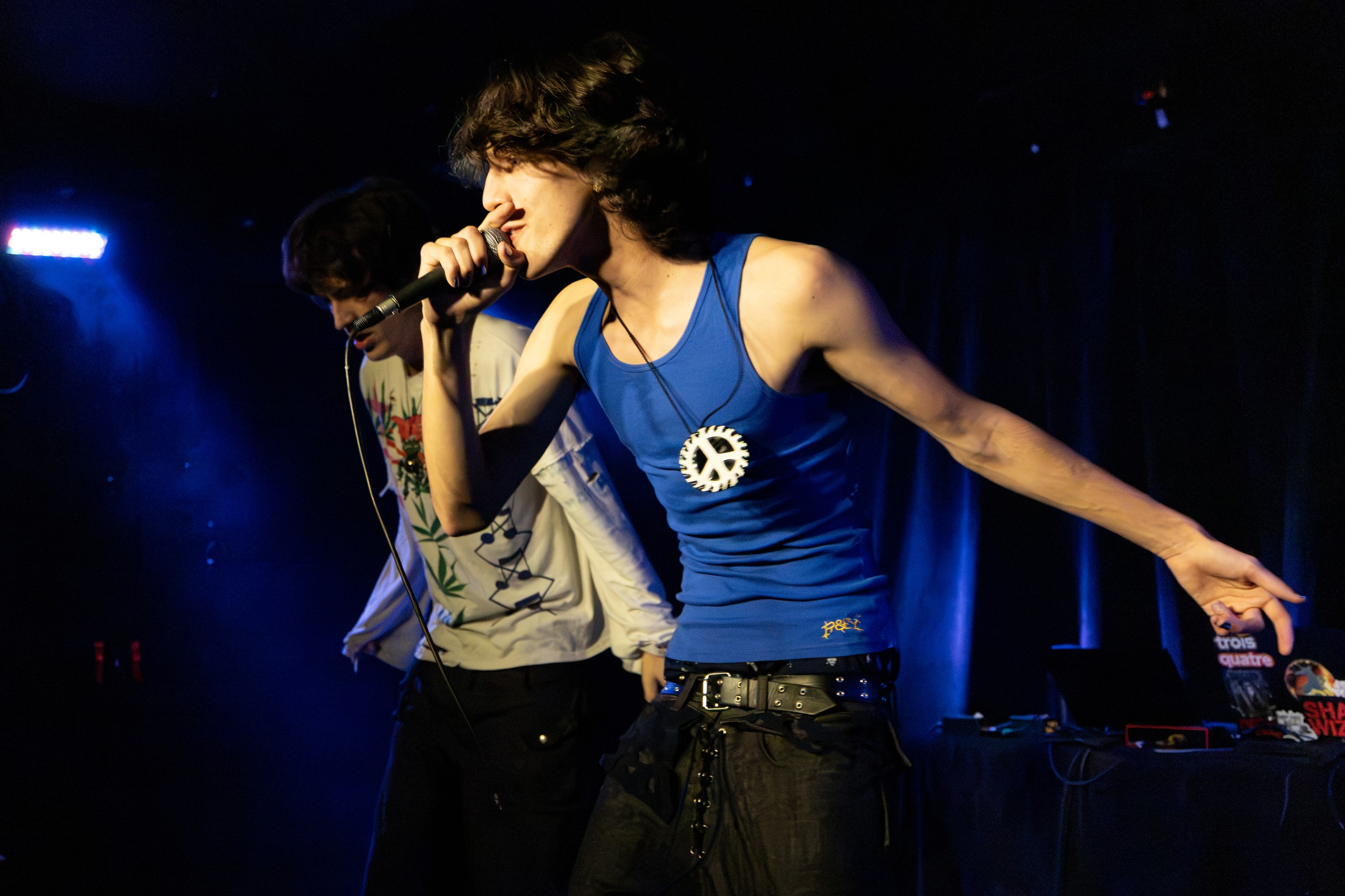 Two rappers perform on stage.