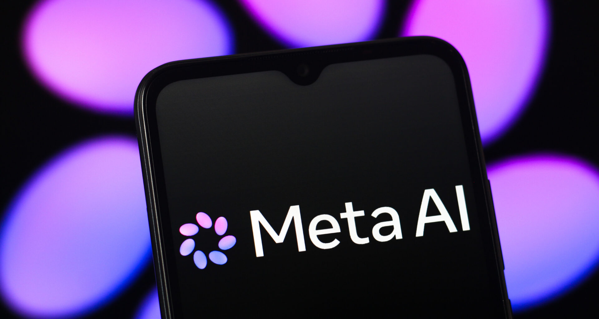 The new Meta AI (Muse Spark) logo is seen displayed on a smartphone screen with purple logo in the background