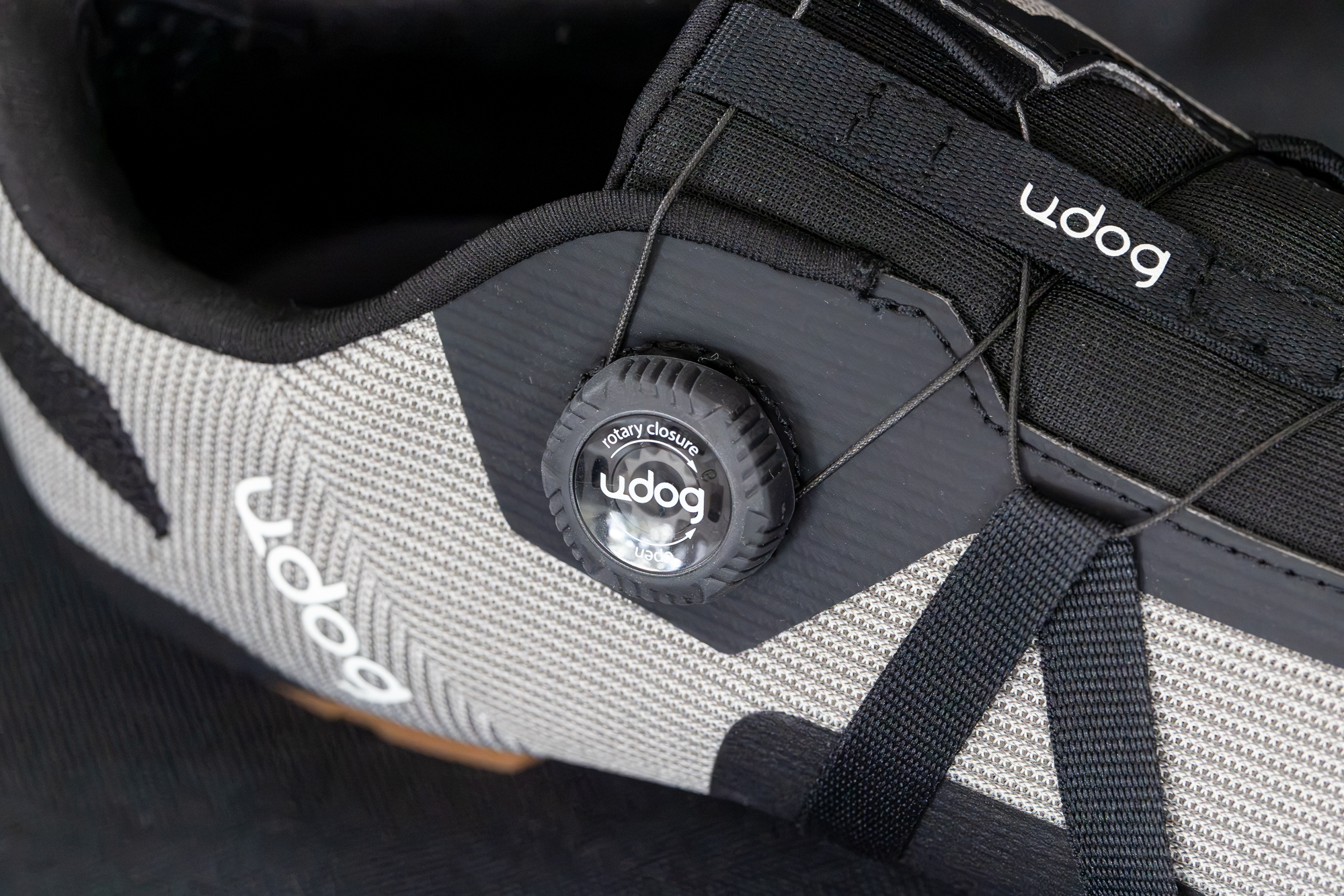 Close up of a grey shoe showing the dial closure