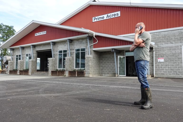 Casey Pruim, owner of Prime Acres Ltd. has a herd of 330 cows at his dairy farm in Abbotsford, British Columbia [Ali Mustafa/Al Jazeera]