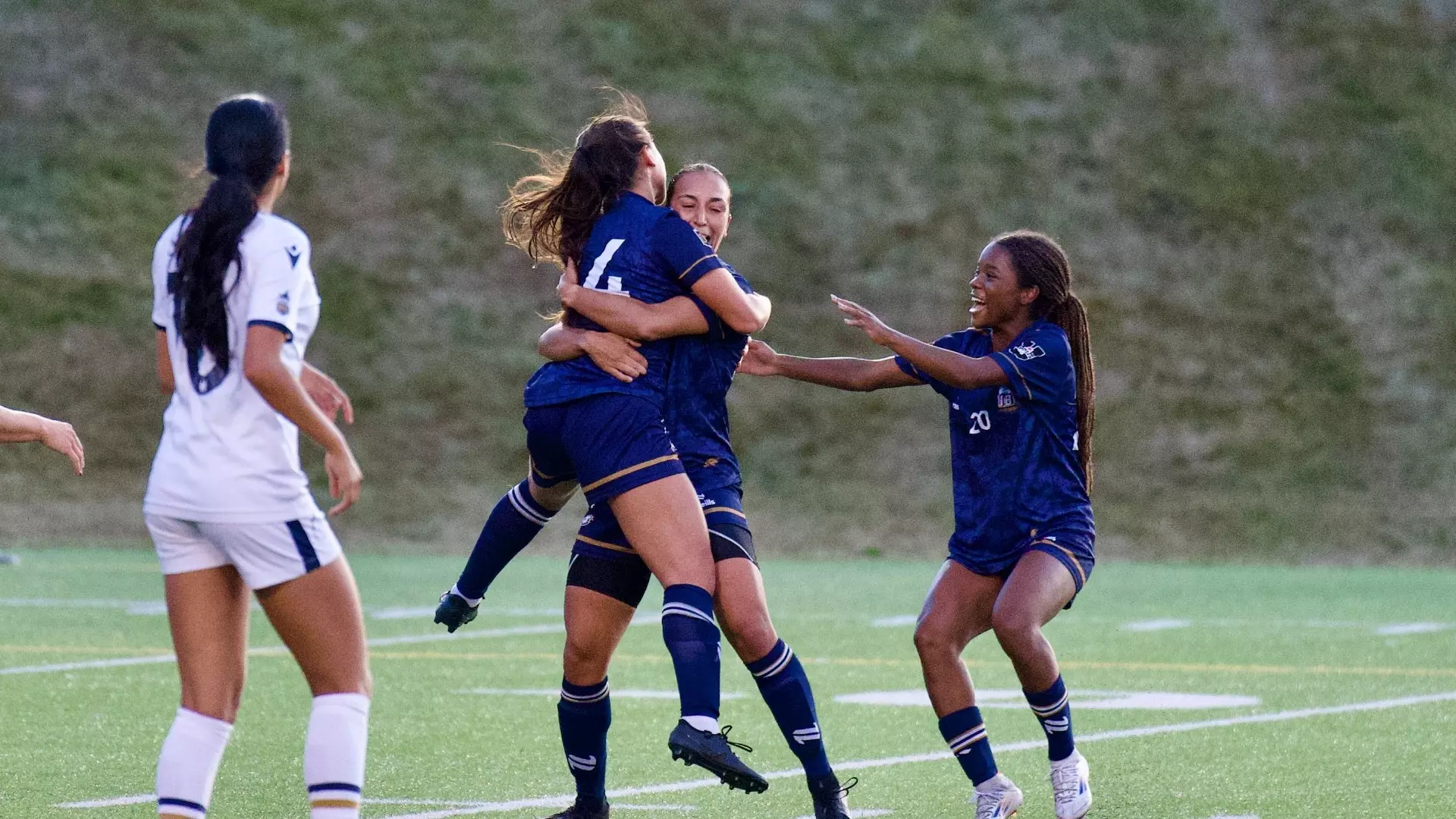 UBC's Sophia Ferreira celebrates with teammates after her first-half goal during a game against the TWU Spartans on Sept. 26, 2026