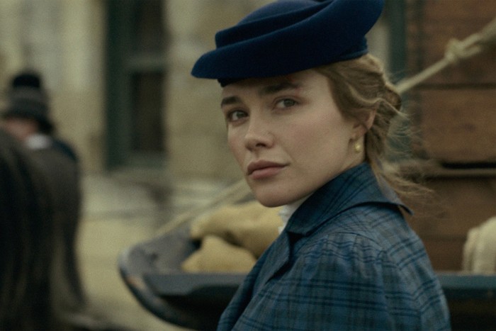 East of Eden Florence Pugh in East of Eden, wearing a blue coat and hat.