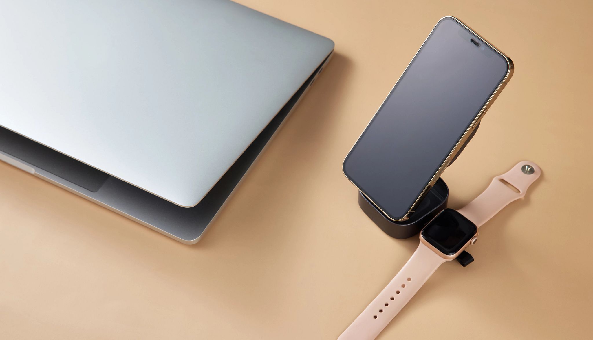a smartphone, smart watch and a laptop