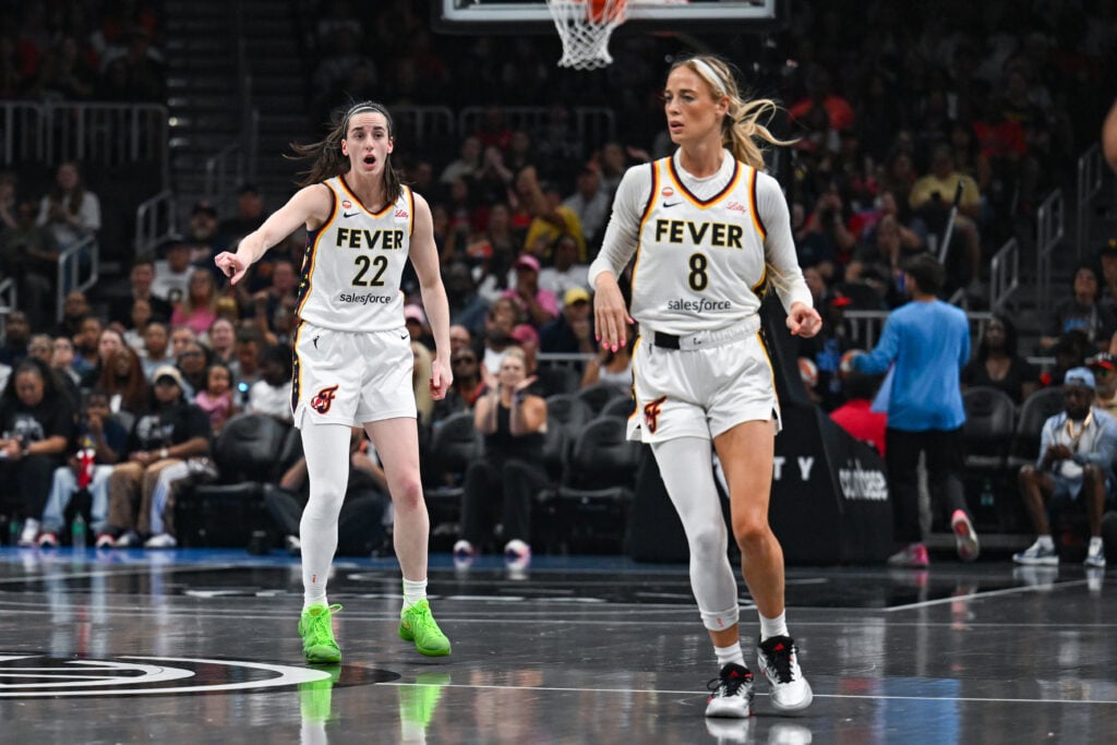 Caitlin Clark #22 of Indiana talks to teammate Sophie Cunningham #8 during the WNBA game between the Indiana Fever and the Atlanta Dream