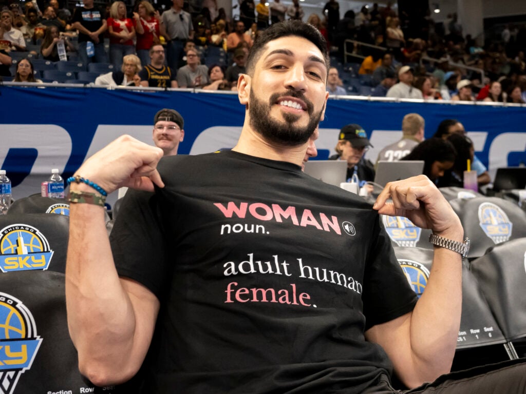 American basketball player Enes Kanter Freedom poses for a photo courtside before the regular season WNBA game between the Indiana Fever and the Chicago Sky on August 23, 2026 at the Wintrust Arena.