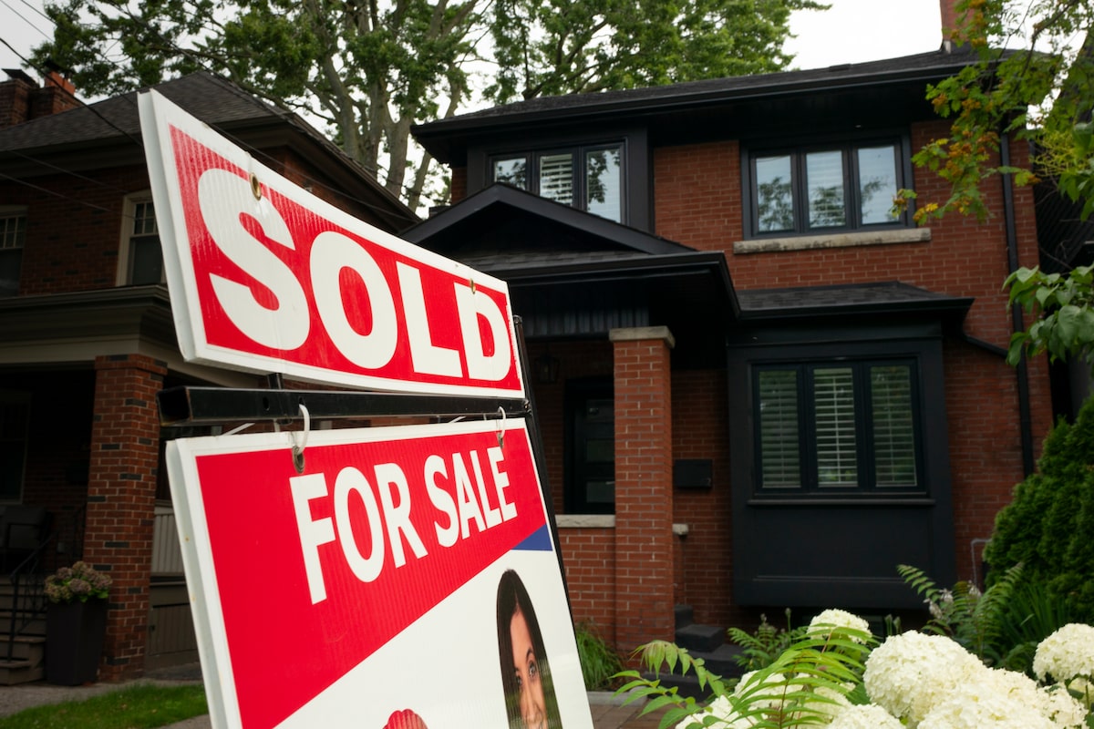 Higher mortgage rates will add more downward pressure on housing prices, economists say