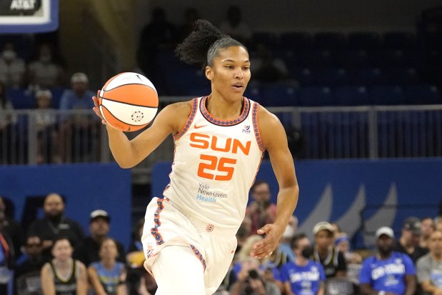Connecticut Sun's Alyssa Thomas advances the ball in Game 5 of a WNBA basketball playoff semifinal against the Chicago Sky Friday, Sept. 9, 2022, in Chicago. The Sun won 72-63. (AP Photo/Charles Rex Arbogast)