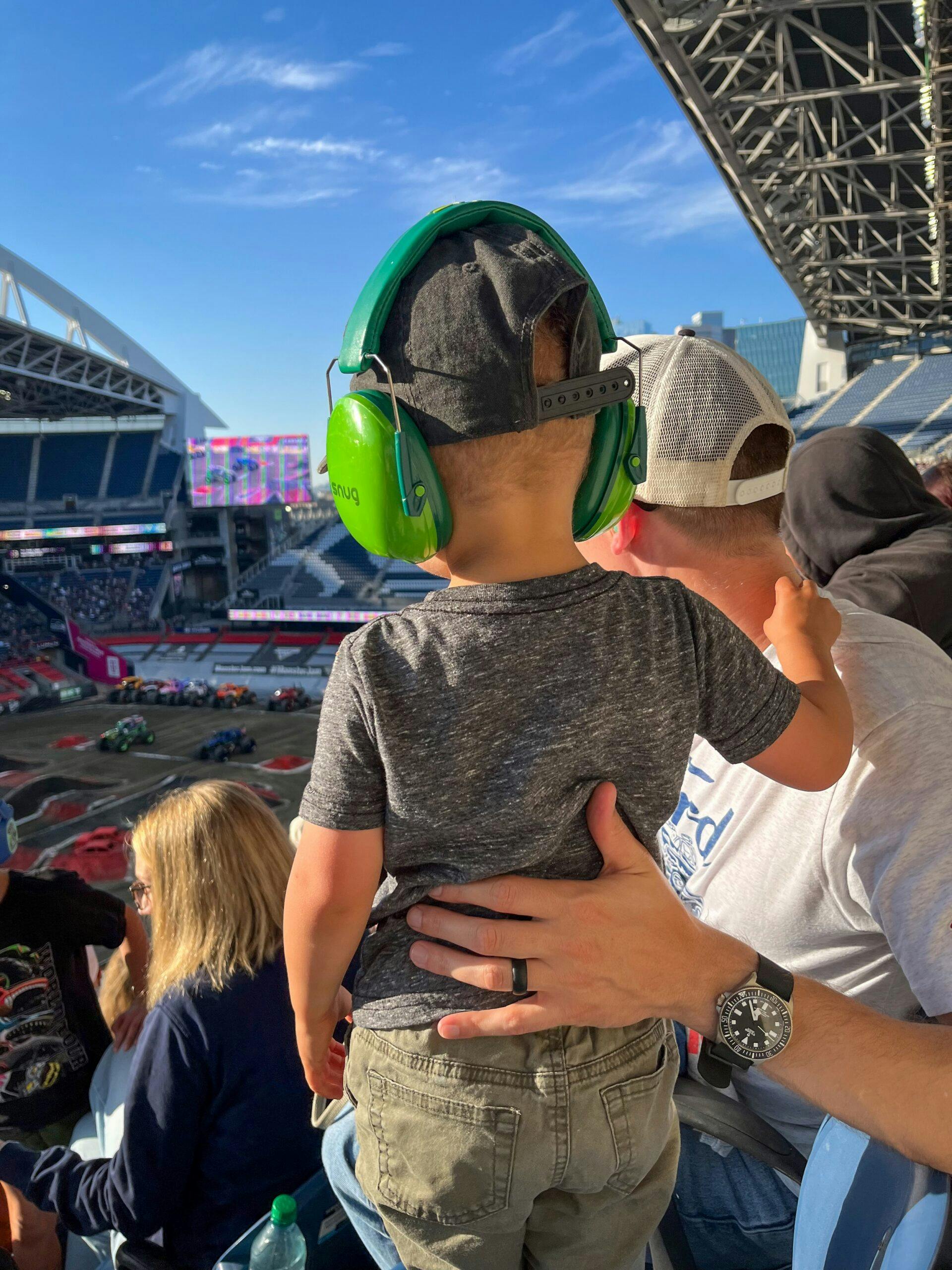 Family monster truck event grandstands father son