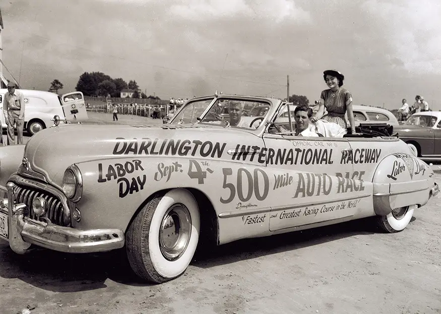 Historic promotional convertible advertising Darlington Raceway’s Labor Day 500-mile stock car race.