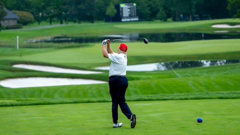 Donald Trump hits a drive from the tee during the pro-am round of the LIV Golf Bedminster. Photograph: Doug Mills/The New York Times