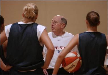 Mike Thibault talks to his team before the start of their first practice.