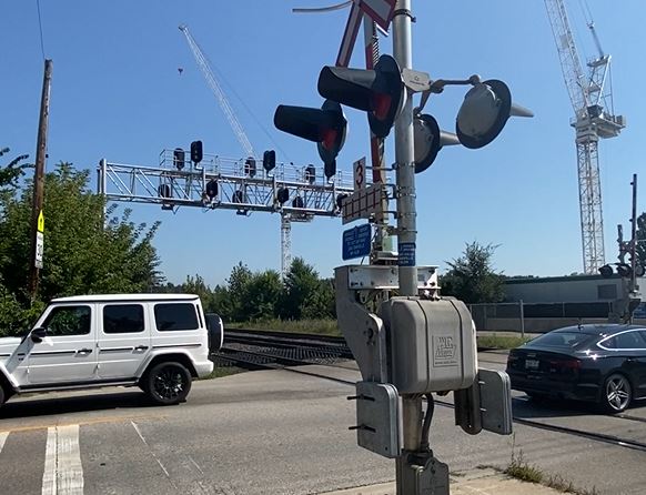 Car driving through a railway crossing
