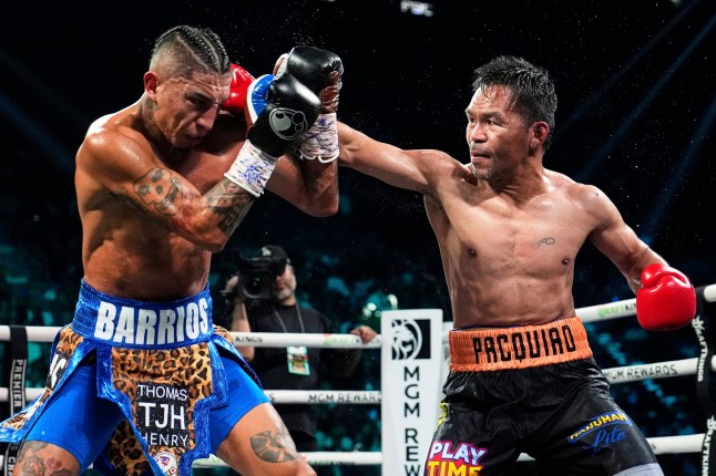 Mario Barrios, left, fights Manny Pacquiao in a welterweight title boxing match Saturday, July 19, 2025, in Las Vegas. (AP Photo/John Locher)
