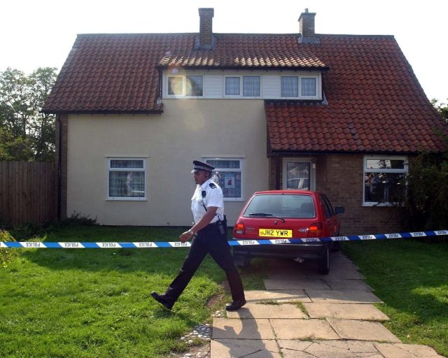 File photo dated 16/08/02 of police officers seal off the home of caretaker Ian Huntley and his partner Maxine Carr in Soham, Camb. Soham killer Ian Huntley has died in hospital after he was attacked in the workshop of the maximum security Frankland prison by an inmate with a metal bar on February 26, the Press Association understands. Issue date: Saturday March 07, 2026. PA Photo. Photo credit should read: Kirsty Wigglesworth/PA Wire