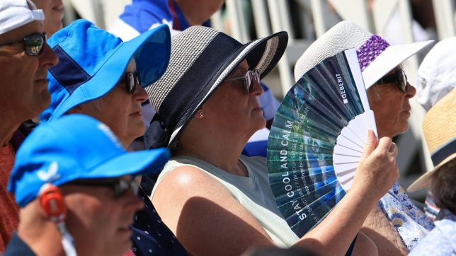 A spectator fans themself as thy watch the play on the first day of the third Test cricket match between England and New Zealand at Trent Bridge in Nottingham on June 25, 2026. (Photo by Darren Staples / AFP via Getty Images) / RESTRICTED TO EDITORIAL USE. NO ASSOCIATION WITH DIRECT COMPETITOR OF SPONSOR, PARTNER, OR SUPPLIER OF THE ECB