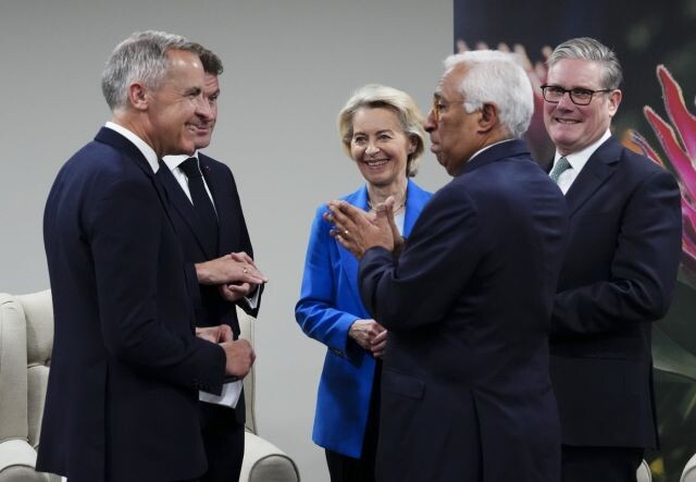 Prime Minister Mark Carney, left to right, French President Emmanuel Macron, President of the European Commission Ursula von der Leyen, President of the European Council Antonio Costa and British Prime Minister Sir Keir Starmer talk as they arrive at a meeting during the G20 in Johannesburg, South Africa, on Saturday, Nov. 22, 2025.