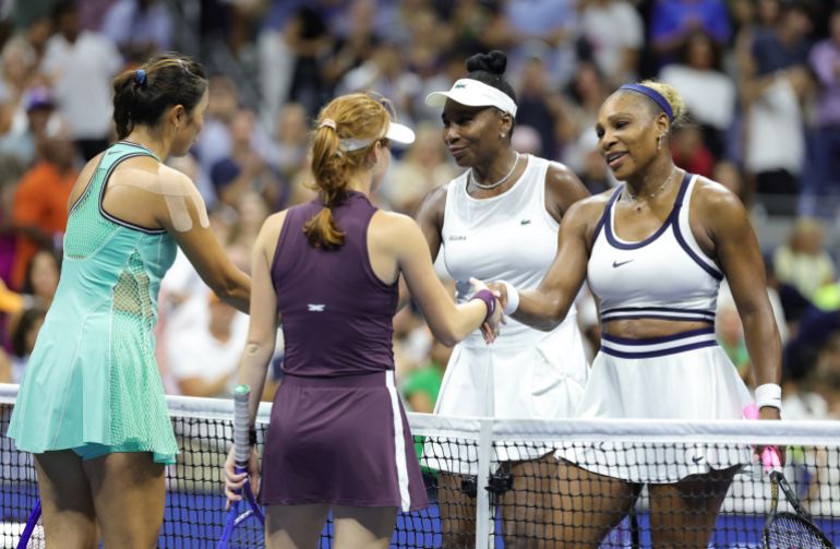 USA's Serena Williams (R) and her sister Venus Williams (2R) shake hands with Australia's Maya Joint (2L) and Taiwan's Chan Hao-ching (L) after losing their women's doubles first-round tennis match on day six of the US Open tennis tournament at the USTA Billie Jean King National Tennis Center in New York City on September 4, 2026. (Photo by KENA BETANCUR / AFP)