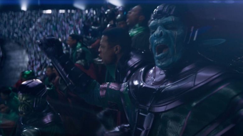 A stadium full of Kang the Conqueror (Jonathan Majors) cheer exuberantly in Ant-Man and the Wasp: Quantumania