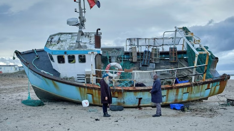 Janet Campbell (Daisy Haggard) and Samuel Wells (Paterson Joseph) meet by a washed-up boat in Boat Story