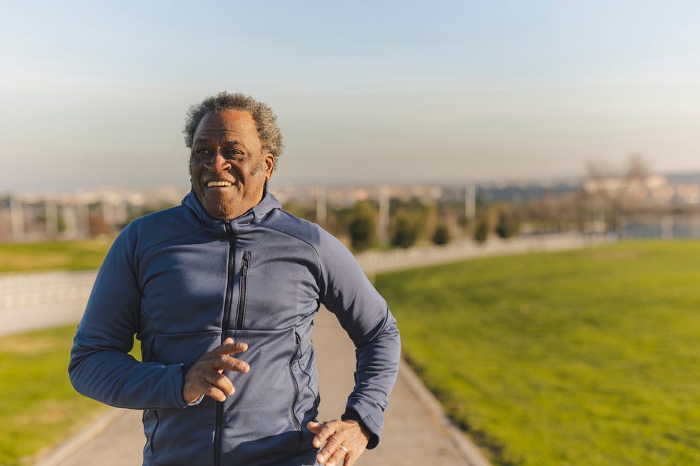 Happy senior man jogging on sunny day happy senior man jogging on sunny day