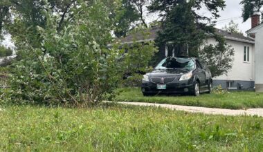 Winnipeg storm sends car flipping onto lawn Sunday night