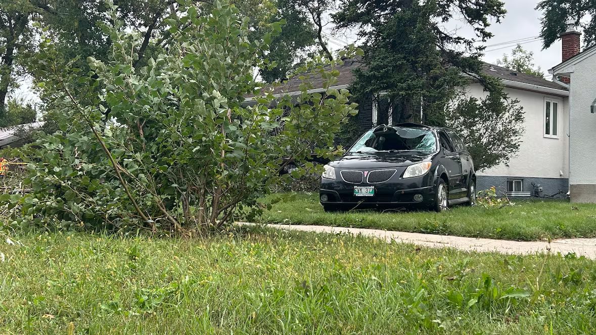 Winnipeg storm sends car flipping onto lawn Sunday night