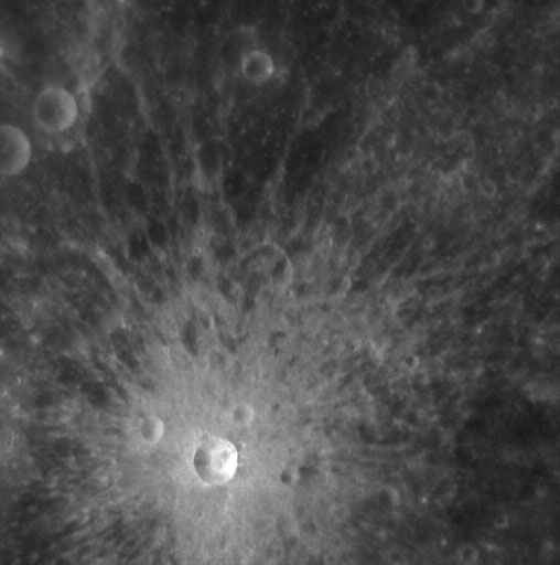 A rough grey surface with circular indentations