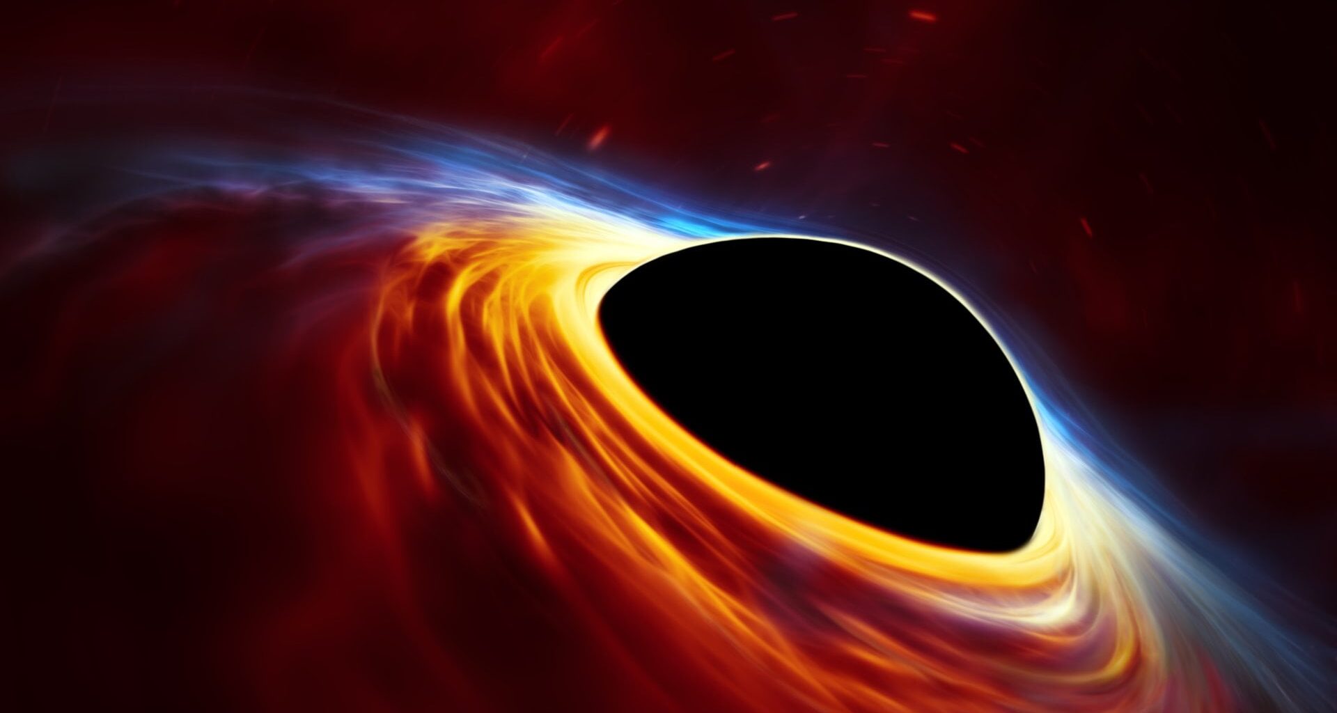 This artist’s impression depicts a rapidly spinning supermassive black hole surrounded by an accretion disc. Credit: ESO, ESA/Hubble, M. Kornmesser