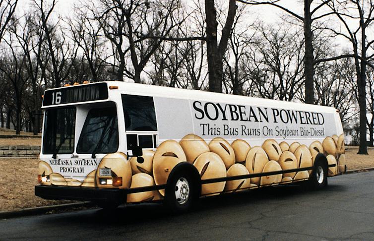 A bus carries a sign reading 'soybean powered.'