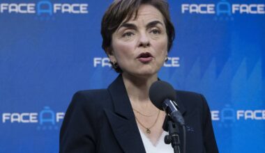 Woman speaks into microphone.