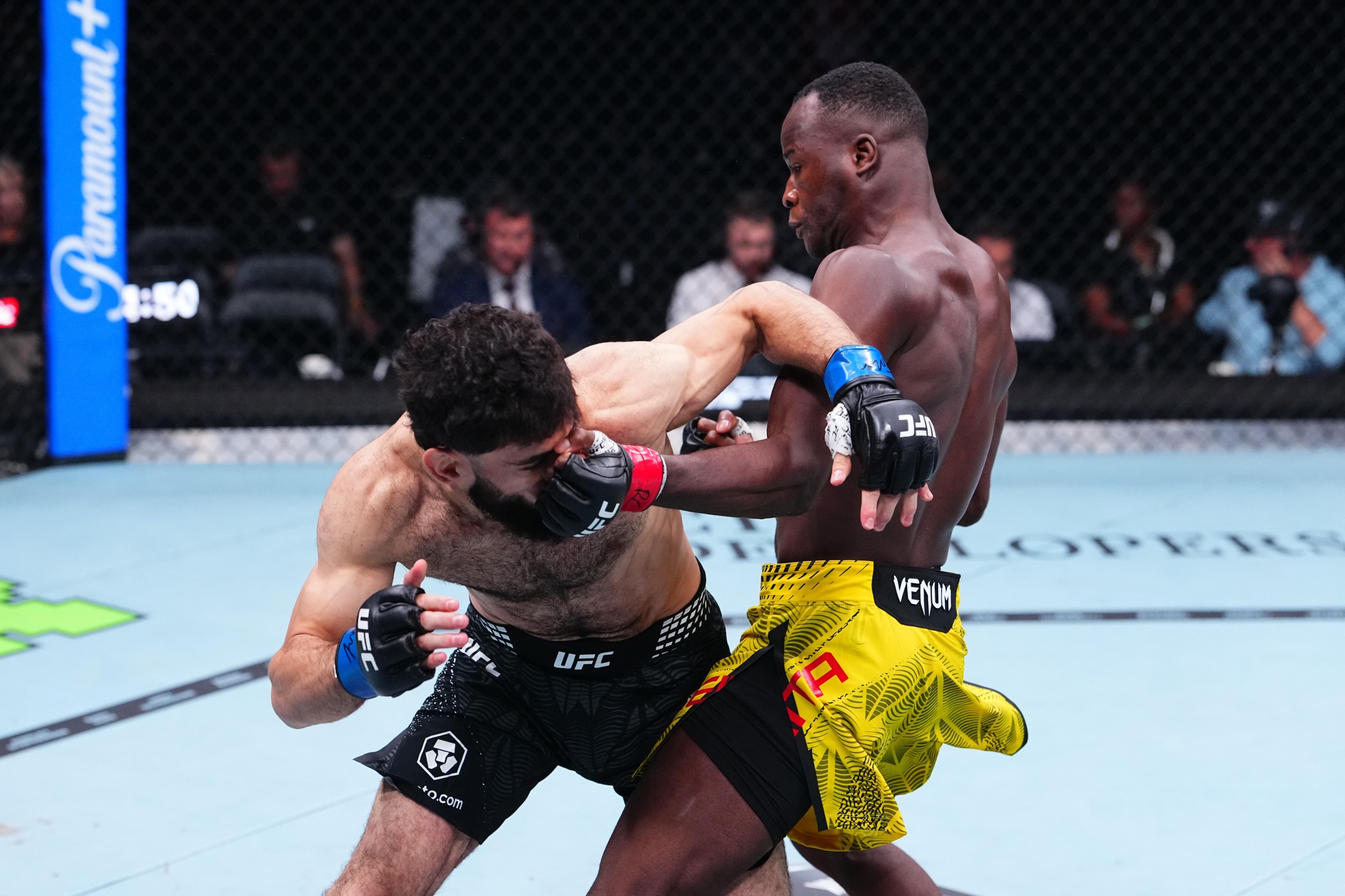 PARIS, FRANCE - SEPTEMBER 05: (R-L) Losene Keita of Guinea punches Muhammad Naimov of Tajikistan in their featherweight fight during the UFC Fight Night event at The Accor Arena on September 05, 2026 in Paris, France. (Photo by Jeff Bottari/Zuffa LLC)